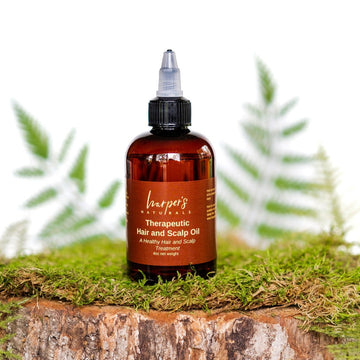 Harper's Naturals Therapeutic Hair and Scalp Oil helps rejuvenate and moisturize the scalp. It's packed with amino acids and vitamins that promote strong, healthy hair growth. It will help strengthen and repair splits ends, while also giving it a luxurious shine.